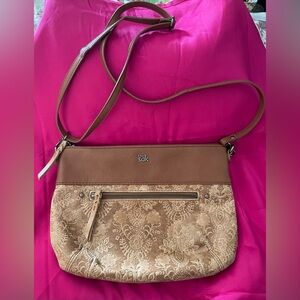 The SAK Tobacco Tan Floral Crossbody used but in fantastic condition.